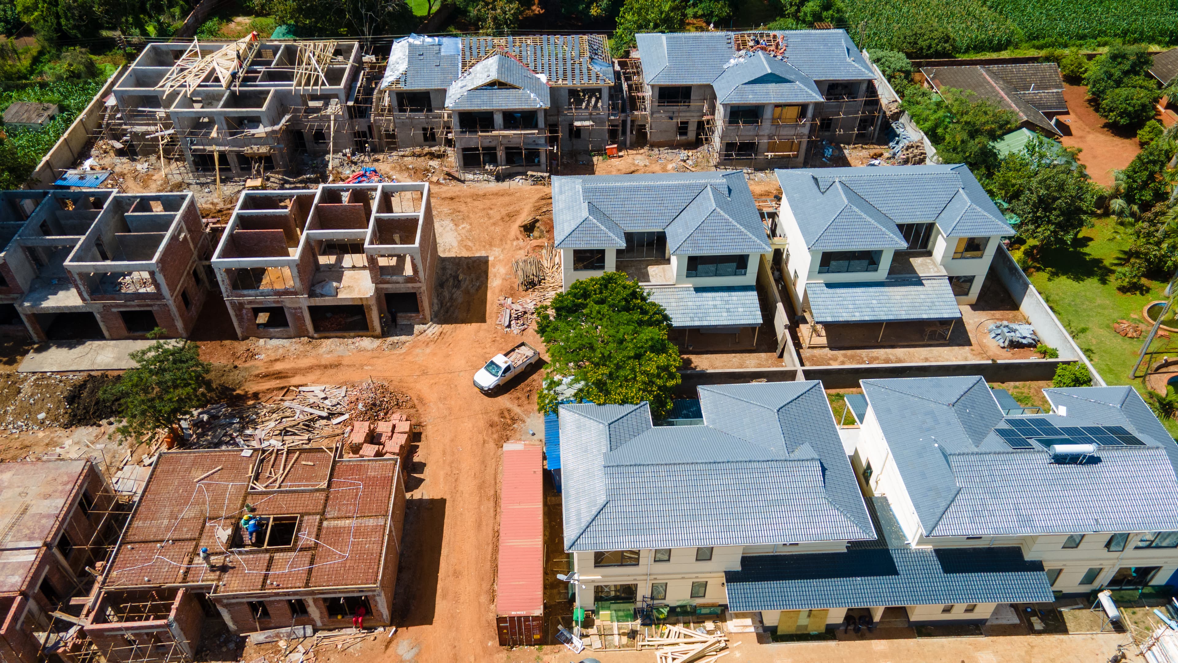 Twilight aerial of Prevail HQ with interior lights visible through glass facade