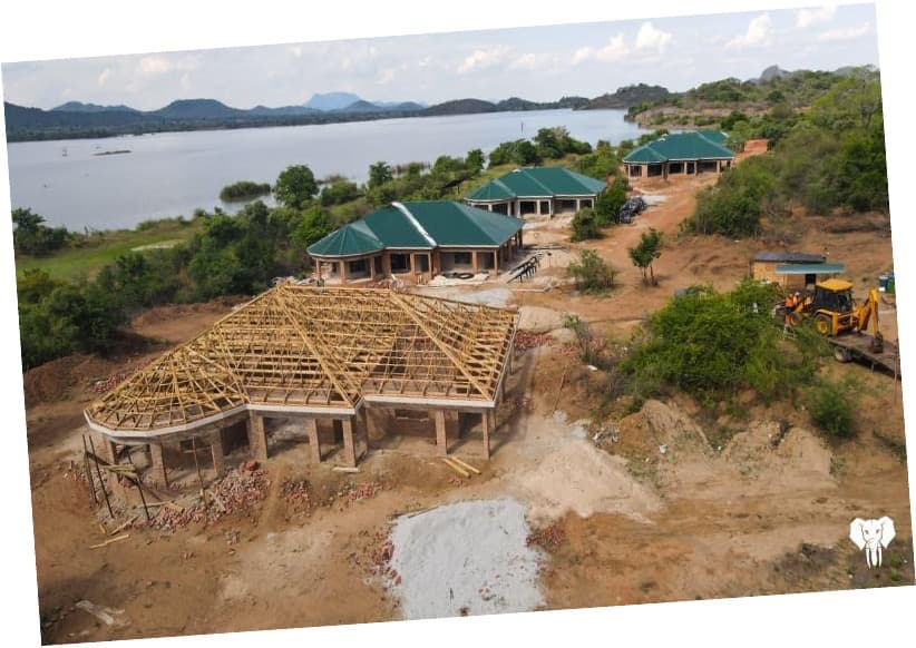 Green roof chalets blending seamlessly with the Mberengwa mountain landscape.